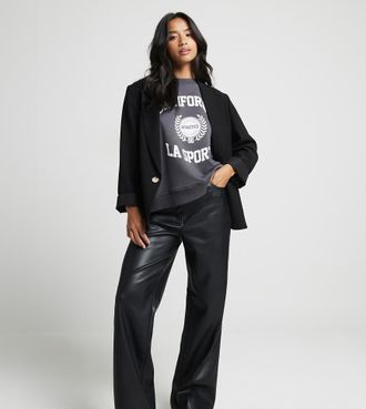 River Island Petite faux leather straight leg pants in black