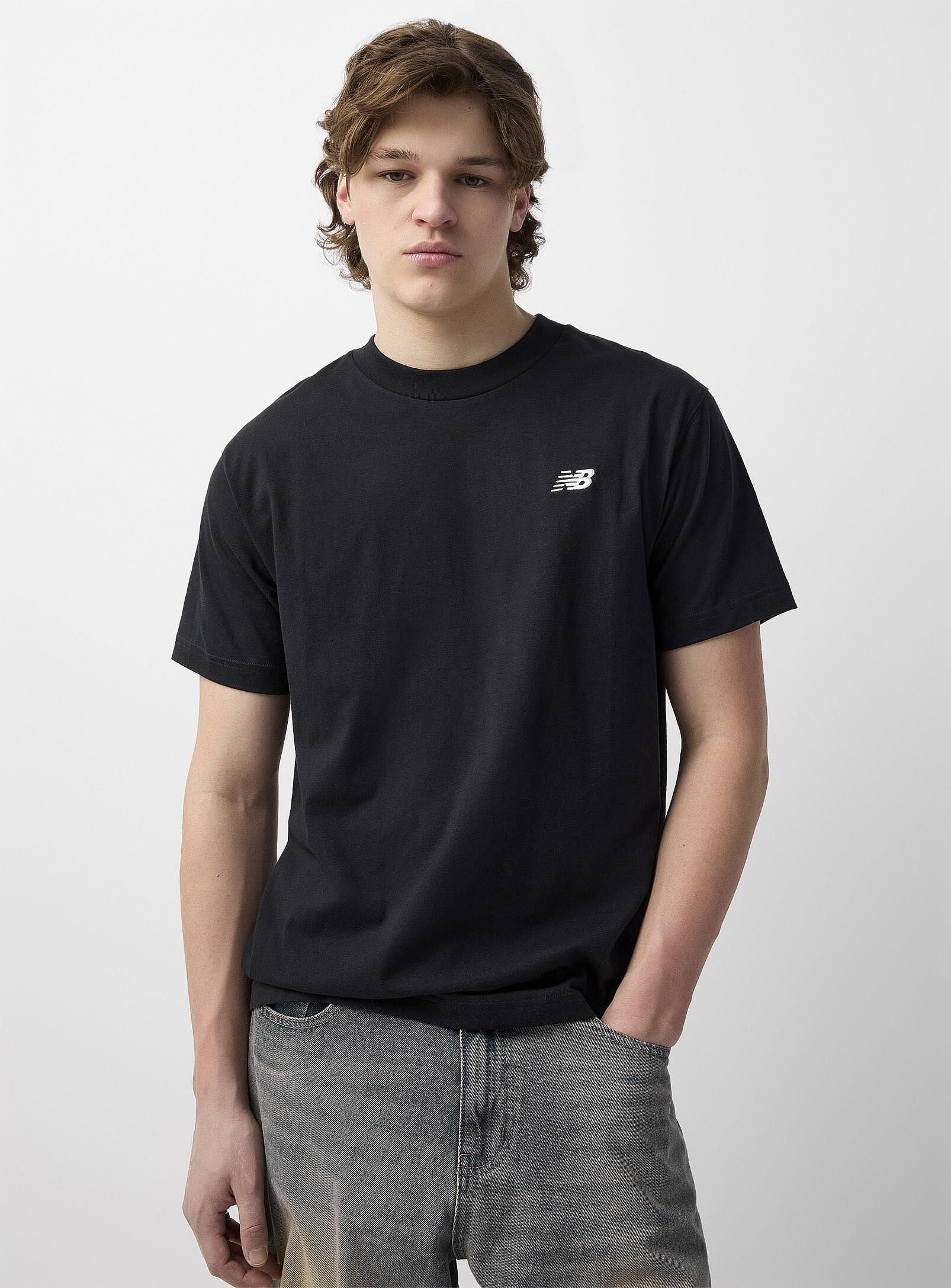 Tシャツ・カットソー New Balance UNI NB FRIENDS SHOEBOX HALF SLEEVE T-SHIRT SEMI New Balance UNI NB FRIENDS SHOEBOX HALF SLEEVE T-SHIRT SEMI