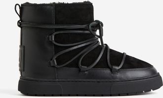 H&M Gef&uuml;tterte Boots aus Veloursleder - Schwarz