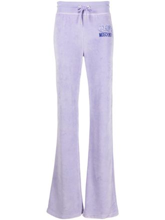 Moschino logo-print velour track pants - women - Cotton/Polyester - S - Purple