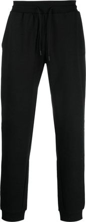 Tommy Hilfiger logo-rubberised track pants - men - Cotton/Polyester - M - Black
