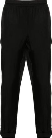 Neil Barrett pressed-crease tapered trousers - men - Polyester/Viscose/TENCEL/Cotton - 44 - Black
