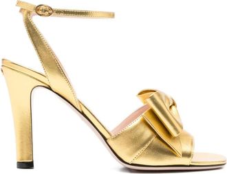 Valentino Garavani 100 mm sandalen met enkelbandje en strik - Goud