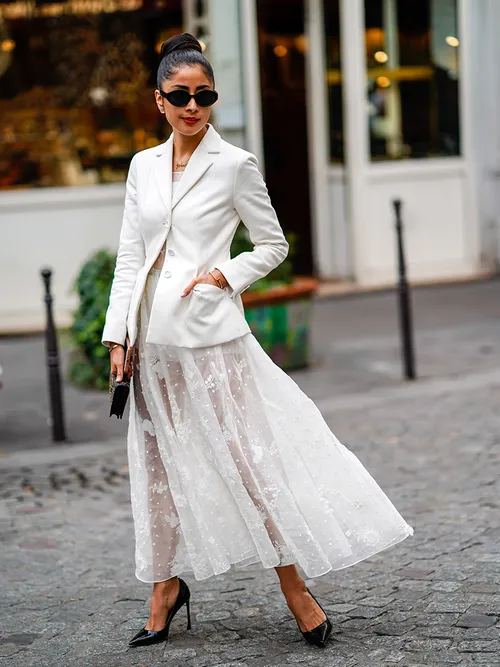 non-traditional bride, non-traditional wedding dresses, wedding dresses, lesbian wedding dresses, androgynous wedding dresses, blue wedding dresses, cape wedding dresses, pantsuit wedding dress, pants wedding dress, alternative wedding dress styles, alternative wedding dress looks