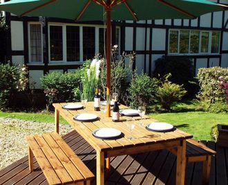 Charles Taylor Trading Six Seater Rectangular Table Set (with form benches) in Brown