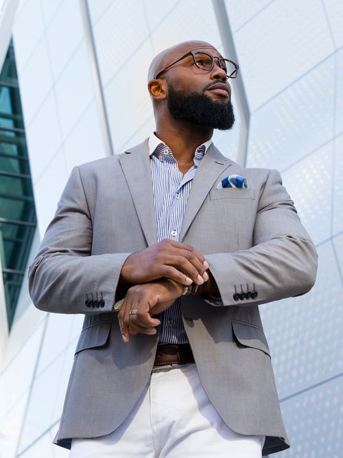 Eyeconic male model wearing suit and glasses