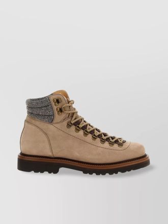 Brunello Cucinelli alpine ankle boots featuring metal eyelets