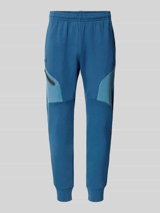Under Armour Regular Fit Sweatpants mit Logo-Print Modell Unstoppable in Blau, Gr&ouml;&szlig;e XXL