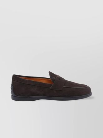 Tod's loafers with gommini on back and penny strap