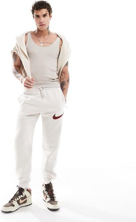 Nike Club Chenile Futura logo joggers in beige-Brown