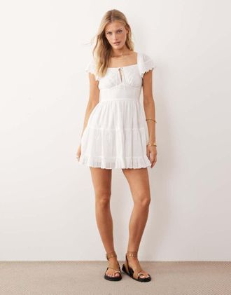 Iisla & Bird Vestito da mare corto in pizzo sangallo bianco