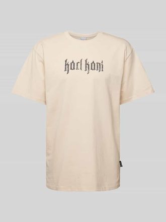 Karl Kani T-Shirt mit Label-Print Modell Signature in Beige, Gr&ouml;&szlig;e XS