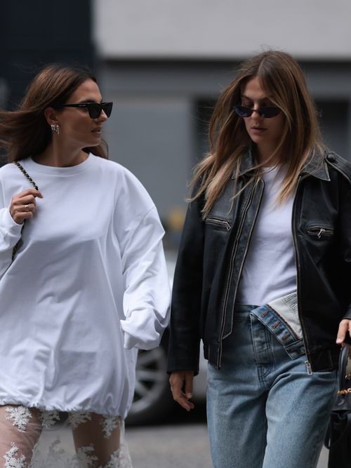 Two guests wearing white T-shirts