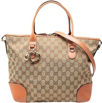 Gucci Pre-owned Handbags, female, Brown, Size: ONE SIZE Pre-owned Vintage Monogram Canvas Heart Charm Satchel