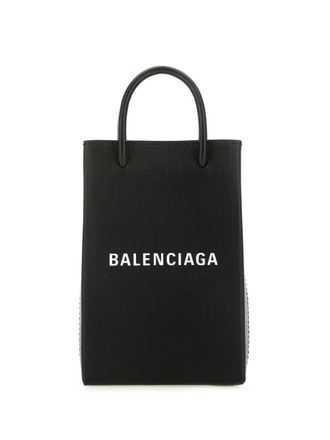 Balenciaga logo-print leather phone case - women - Fabric/Calf Leather - One Size - Black