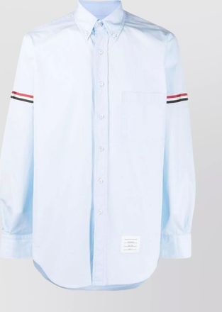 Thom Browne curved hem shirt with buttoned cuffs and striped trim
