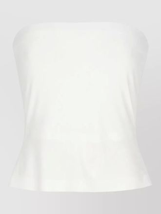 Norma Kamali sleeveless fitted top featuring peplum hem
