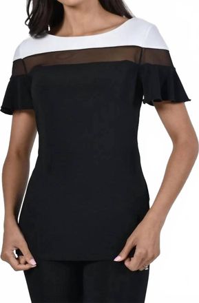 Frank Lyman Design Brenlynn Ruffle Short Sleeve Knit Top With Sheer Panel In Black And Off White