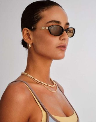 Le Specs Lunita - Occhiali da sole ovali neri con lenti marroni-Nero