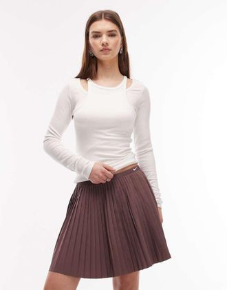 Nike Minigonna a pieghe viola scuro-Marrone