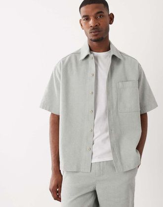Boss Orange by Hugo Boss Hugo Boss - Camicia a maniche corte in denim turchese con bottoni in coordinato-Blu