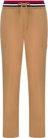 Moschino logo-appliqué track pants - men - Cotton/Polyamide - 48 - Brown