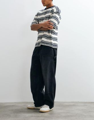 Carhartt Work in Progress OG jeans loose fit a doppio ginocchio in nero slavato con abrasioni