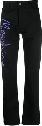 Moschino tailored logo-print trousers - men - Elastane/Cotton - 46 - Black