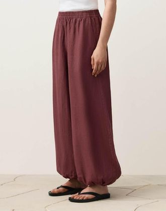 Oysho Pantaloni a palloncino in 100% lino rosso scuro