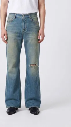 Amiri Jeans flared in denim a cinque tasche con effetto usurato