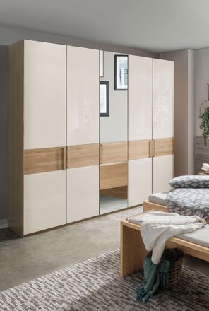 Wiemann Drehtürenschrank »Kiruna« mit Champagnerglas und Spiegel