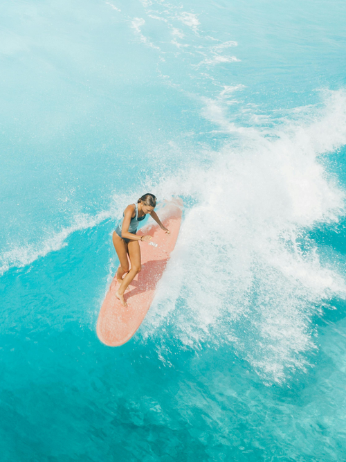 Girl surfing waves