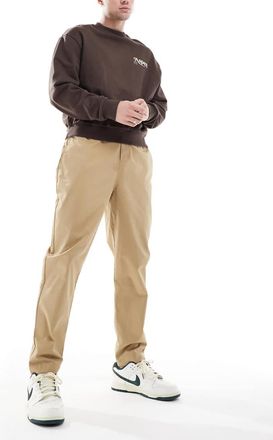 Nike Club woven tapered pants in beige-Neutral