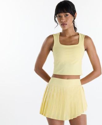 New Balance Mujer Tournament NYC Tank en Amarillo/Azul, Poly Knit, Talla XS