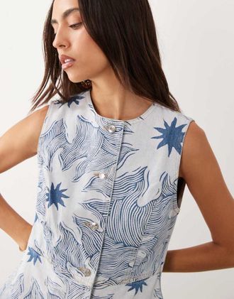 Never Fully Dressed co-ord con gilet lungo in twill di denim di cotone con stampa soleil blu-Marrone