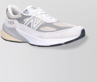 New Balance low top sneakers with mesh upper and rubber sole