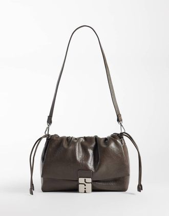 Sui Ava borsa icon in marrone