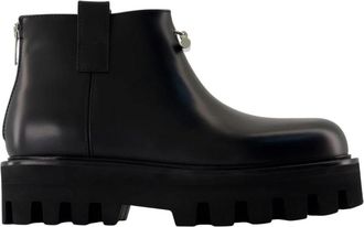 Alexander McQueen Laarsjes met rits en profielzool - Dames - Enkellaarsjes - Zwart - 41 EU - Leer - Schoenen