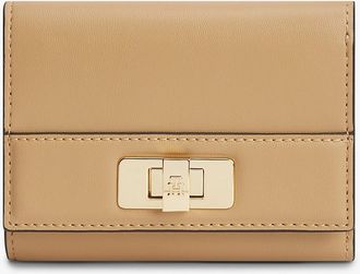 Tommy Hilfiger Womens Monogram Turnlock Trifold Wallet - Beige
