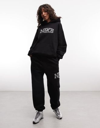 Nike Studio - Joggers oversize in pile di media pesantezza neri con logo-Nero