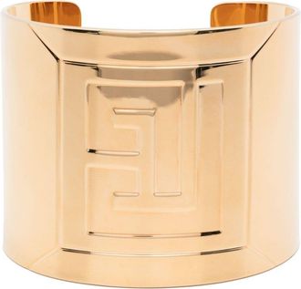 Balmain logo-engraved cuff bracelet - men - Brass - M - Gold