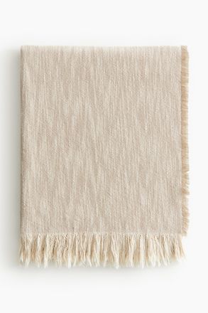 H&M Decke aus geflammtem Webstoff mit Fransen - Beige