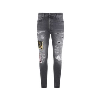 Amiri Ripped Patch Skinny Jeans