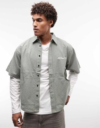 XLARGE Camicia a maniche corte verde a quadri doppi con tasche a marsupio