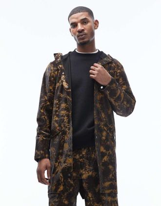 Rains 12020 - Giacca lunga impermeabile unisex con cappuccio marrone con stampa effetto fango