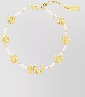 Marc Jacobs beaded balloon bracelet and flower charms