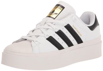 adidas Originals Womens Superstar Bonega Sneaker, White/Black/Gold Metallic, 7