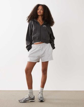 New Balance Trackside - Felpa con cappuccio e zip in felpa nera-Nero