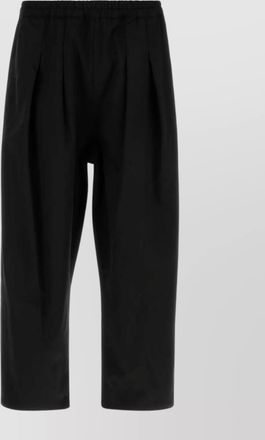 Maison Margiela tailored twill trousers featuring pleated front