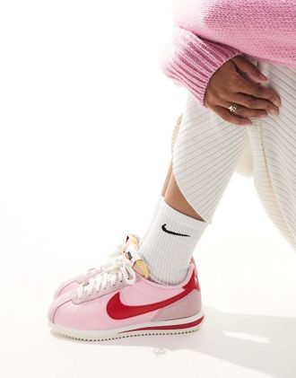 Nike Cortez sneakers in pink and red